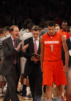 Michael Carter-Williams grins as he walks off the court after successfully defeating Georgetown in the Big East Tournament at Madison Square Garden.