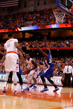 Christmas battles Jervon Pressley in the paint as McCullough watches from the left.