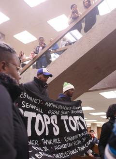 Students react as marchers participate in four and a half minutes of reflection during the 