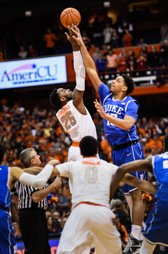 Rakeem Christmas goes up for the opening tip with Duke's Jahlil Okafor on Saturday evening at the Carrier Dome. 