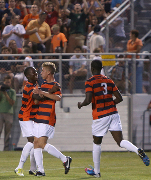 Syracuse players celebrate during the Orange's season-opening 2-0 win over Albany on Friday. 