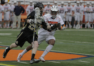 Syracuse midfielder Hakeem Lecky defends Army's Pat Brennan. The Orange held the Black Knights to just two goals on Sunday.