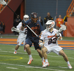 Syracuse midfielder JoJo Marasco works around a defender. He beat the Virginia defense for a pair of goals in the Orange's upset victory.