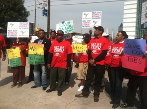 Members and supporters of the Atlanta Vendors Association protest a city ordinance that cracks down on street vending outside the Georgia Dome on Saturday. The Atlanta Police Department began enforcing the ordinance last week. 