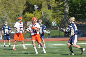 David Hamlin defends in Syracuse's 9-3 win over Notre Dame in the Big East tournament semifinals on Thursday. Hamlin and the rest of the Orange's defense shut down one of the best offenses in the country for the second time in a week, holding the Fighting Irish to just three goals. 