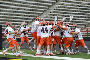 Syracuse celebrates its 7-6 comeback victory against Yale. Dominic Lamolinara recorded nine saves including one point-blank on Conrad Oberbeck with less than two minutes to play.