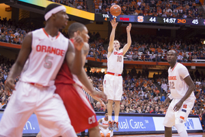 Trevor Cooney sinks one of his seven 3-point buckets to put Syracuse ahead of Cornell. 