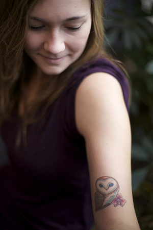 Chloe Quakenbush, a junior psychology major, got a tattoo of an owl and an orchid, to honor the passing of both her sister and her grandmother.