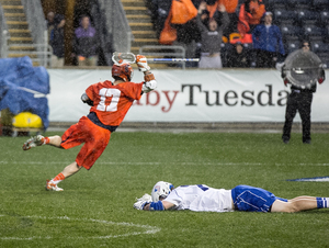 Dylan Donahue celebrates after netting the game-winning goal with less than a second remaining in a 16-15 win over Duke on Friday. 