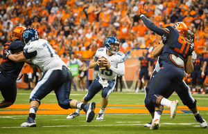 Villanova quarterback John Robertson surveys the field from a collapsing pocket during Syracuse's 27-26 win Friday night.