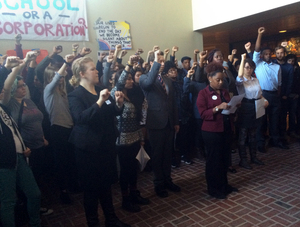 Protesters gather in the lobby of Crouse-Hinds Hall during a press conference about the Diversity and Transparency Sit-in on Wednesday afternoon.