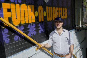 Adam Gold bought a failing coffee shop and turned it into Funk 'n Waffles. He was inspired to start his own business after performing and serving waffles at parties.