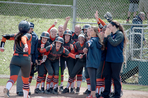 Mary Dombrowski prepares to touch home after her grand slam on Senior Day. Her third-inning shot accounted for four of SU's 11 runs on the afternoon.