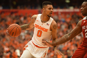 Michael Gbinije scored 34 points as Syracuse took down North Carolina State, 75-66, on Saturday.