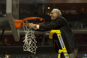 Jim Boeheim and Syracuse cut down the nets after its comeback 68-62 win over Virginia on Sunday. 