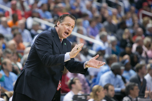 North Carolina State head coach Mark Gottfried wills his team in its 2014 ACC tournament win over SU.