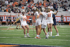 Syracuse celebrates one of their 23 goals in Friday's win. 