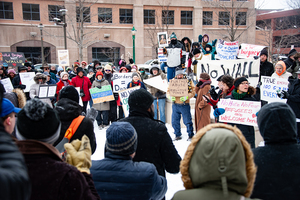 About 40 people gathered outside the federal courthouse in downtown Syracuse to protest President Donald Trump’s immigration policies. 