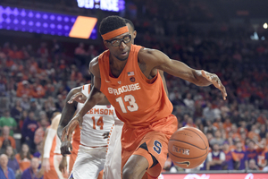 Paschal Chukwu goes for a loose ball in Syracuse's loss. He had two points and two rebounds.