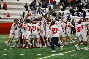 Syracuse celebrates after defeating Johns Hopkins.