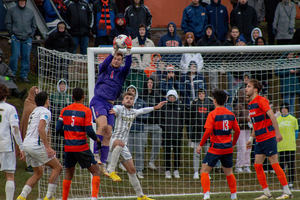 Russell Shealy (pictured No. 1) made key stops in the waning moments of the match to move SU into the College Cup.