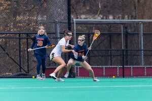 Freshman Caroline Trinkaus switched from midfield to attack in her second career game, scoring three goals to help secure SU's 15-9 win.