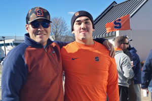 Brett Bucktooth Jr. (pictured, right) is next in line among the Bucktooth family's lacrosse legacy, taking the reins from his father Brett Sr. (pictured, left), who helped Syracuse win the 2004 NCAA Championship. 