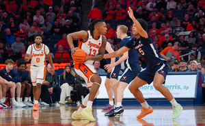 Jyáre Davis' 15 points helped propel Syracuse to a 84-70 win over Virginia to cap the regular season.