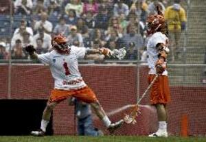 Pat Perritt gives his teammate a high five during Syracuse's 17-7 rout of Duke. The Orange advance to the title game against Cornell Monday at 1 p.m. at Gillette Stadium.