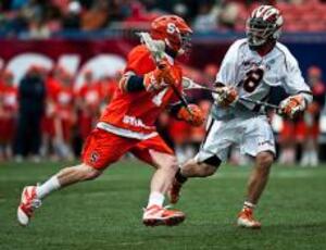 Pat Perritt attempts to get around Princeton's Chris Peyser during Syracuse's loss at Giants Stadium. The Orange had two 14-minute scoring droughts in Saturday's game. 