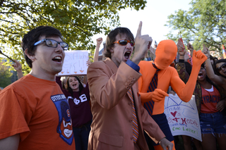 (From left) Brad Slavin, a junior information management major; Ben Maher, a junior sports management and psychology dual major; and Michael Collins, a junior history and economics dual major, cheer at the 