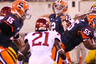 Syracuse Orange quarterback Ryan Nassib #12 throws a pass in a rainy second half. 