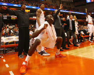 Baye Moussa Keita and the rest of the SU bench celebrate during the final moments of team's 99-63 victory.