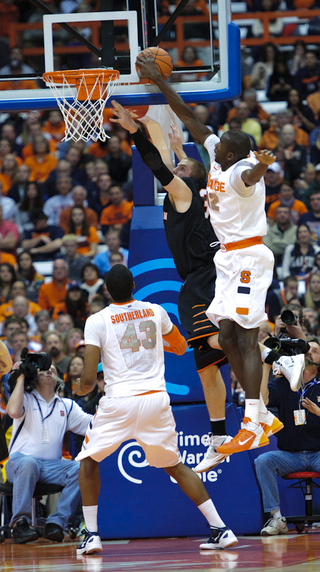 Syracuse center Baye Moussa Keita pins a shot against the glass.