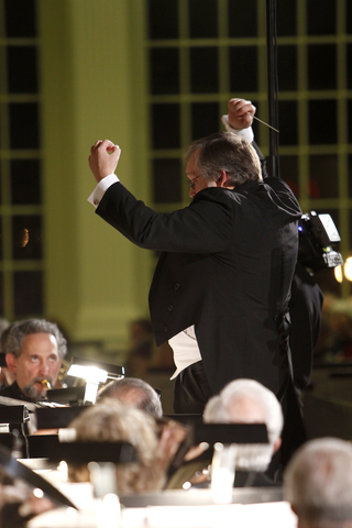 Jim Spencer, the director, conducts the ensemble during the concert. The ensemble performed a variety of songs, highlighting the French horn and trumpets. 