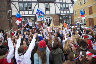 The Kappa Alpha Theta sorority dances with new members outside of its house on Walnut Place. 