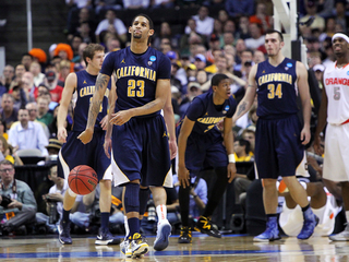 Allen Crabbe #23 of the California Golden Bears throws the ball away as he walks on the court late in the game against the Syracuse Orange