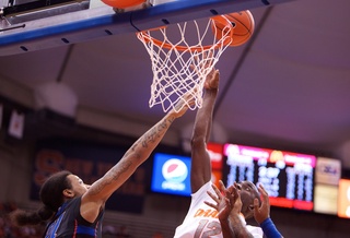 Baye Moussa Keita rises above the DePaul players to grab a rebound. Keita snagged four in the 78-57 win.