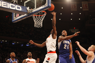 C.J. Fair goes for a layup past Gene Teague. Seton Hall's 290-pound center struggled with SU's quicker big men all night.