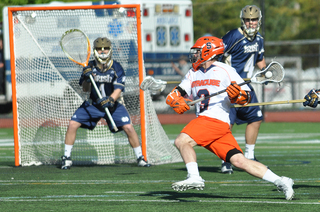 Billy Ward winds up for a shot as he cuts toward the net.