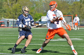 Steve Ianzito wards off a check from Notre Dame's Tyler Kimball.