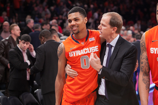 Michael Gbinije grins as he leaves the court.