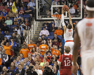 Ennis goes up for a two-handed dunk on the fast break. 