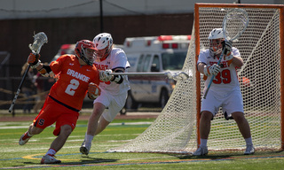 Syracuse attack Kevin Rice turns the corner, looking for an opening in the Hobart defense.