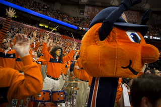 Chris Mandry, a Syracuse alum, raises his drumsticks in the air during a Florida State free throw late in the second half. 