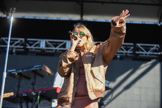 Tove Lo directs the crowd with her hand motions during her set. 