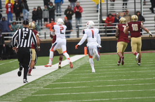 Dungey wraps up BC's William Harris after being intercepted. Dungey threw Harris to the turf after he was well out of bounds.