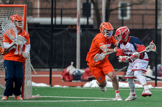 Gillis works to keep a St. John's player in front of him. 