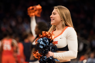 A Syracuse cheerleader dances.