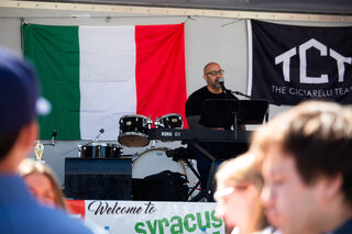 Local Syracuse artist Just Joe plays the piano and sings song covers, including “Vienna” by Billy Joel, to a crowd that eats, laughs and banters. A variety of musical groups were highlighted on two different stages from the very beginning to the very end of each day.